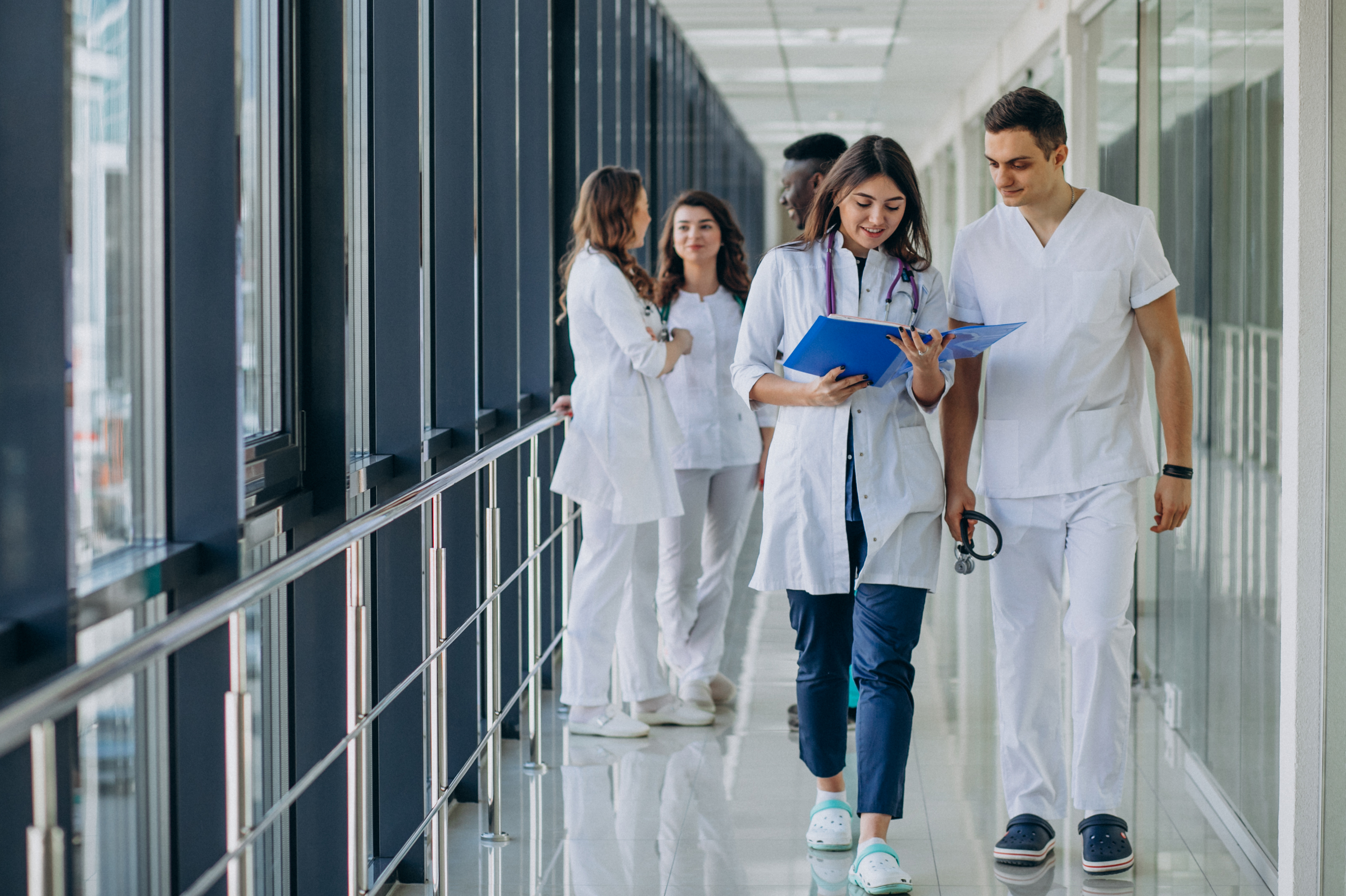 A team of healthcare professionals walking through a hospital